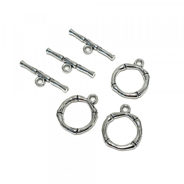 3 sets. Fermoirs en T diam 20 mm, barre 26 mm. Alliage argenté