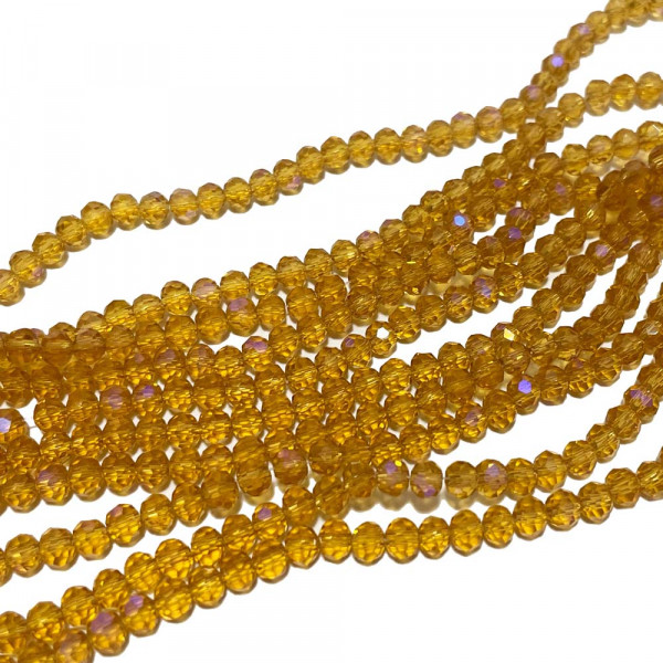 4*3 mm. Perles verre à facettes, orangé irisé. Fil 123 p