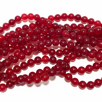 8 mm. Perles jade rouge naturelle. Fil 48 p. Translucide.