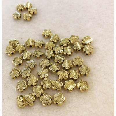 10 perles étoile, alliage doré. 7 mm