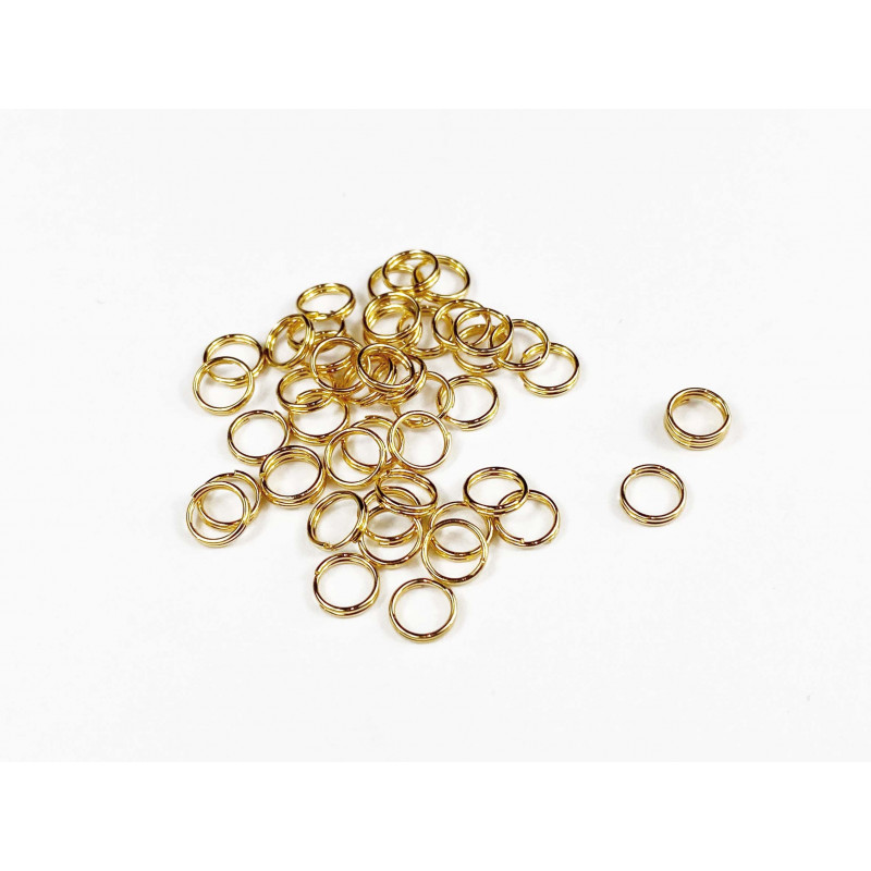 50 anneaux double en acier inoxydable doré. Diamètre 5 mm. Diamètre  intérieur 4 mm. Apprêts pour créations de bijoux