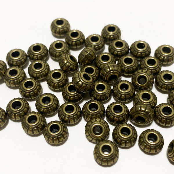 50 perles séparateurs alliage bronze 6*4 mm.