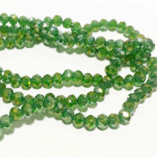 6*5 mm, perles verre à facettes irisé. Vert. Fil de 88 perles env.